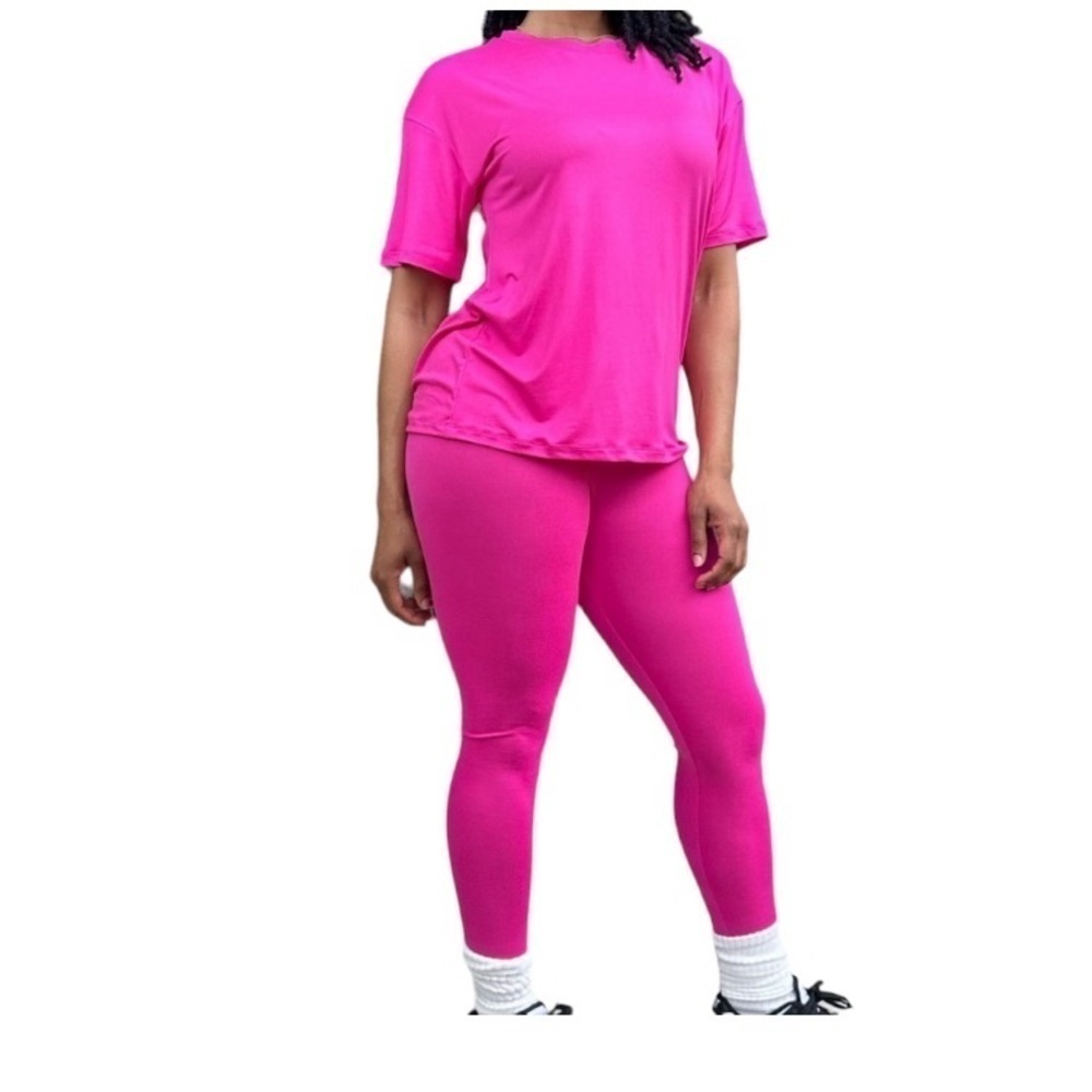 Fuschia short sleeve shirt and legging set. NWT. 92 % polyester 8% spandex.
